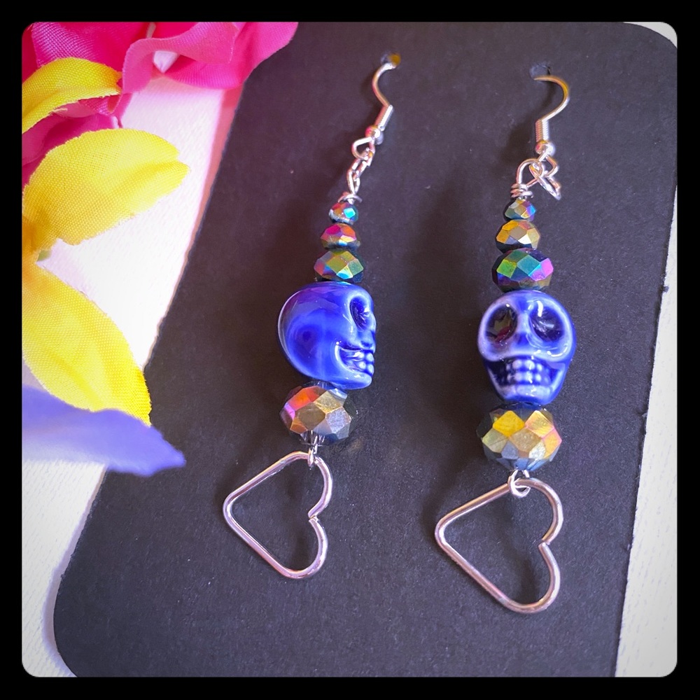 Blue glass skull earrings